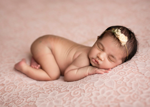 Naked Baby sleeping during photo shoot in Zürich